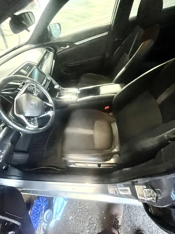 Honda Civic interior after a full interior detail — dash, seats and floors freshly cleaned